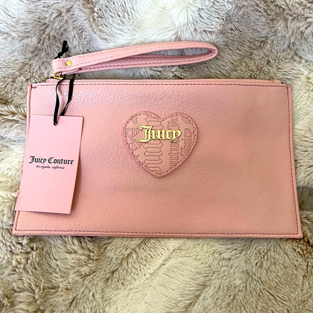 Juicy Couture Wristlet in baby Pink.